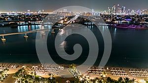 Jumeirah Palm island skyline night timelapse in Dubai, UAE.