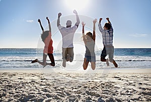 Jump, beach or back of friends on holiday vacation in the air together in summer at sea. Outdoor, group or excited men