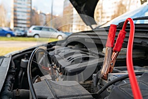 Jump cables on car battery