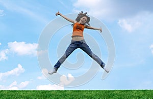 Jump girl over a grass