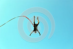 Jump off a cliff with a rope.Bungee jumping