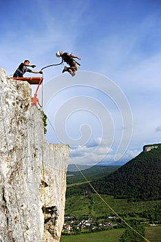 Jump off a cliff with a rope.Bungee jumping