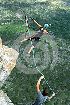 Jump off a cliff with a rope.Bungee jumping