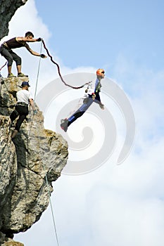 Jump off a cliff with a rope.Bungee jumping