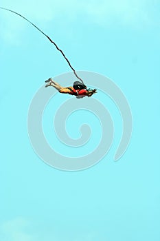 Jump off a cliff with a rope.Bungee jumping