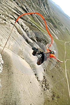 Jump off a cliff with a rope.Bungee jumping