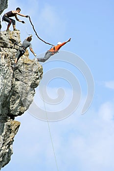 Jump off a cliff with a rope.Bungee jumping