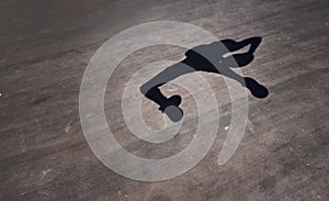 Jump, pivot and twist your way to the hoop. the shadow of a man throwing a basketball on a sports court.