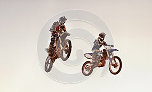 Jump, race and men on dirt bike with adventure, adrenaline and speed in stunt competition, Extreme sport, trick and