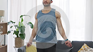 Jump rope, fitness and home exercise of a man working out in a home living room. Health, workout and sports training of