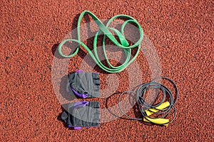 Jump rope, sports gloves and a tourniquet for sports training