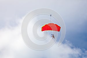 Jump in tandem skydivers-athletes with a parachute.