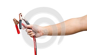 Jumper cables in male hand isolated on white