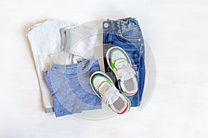 Jumper,t shirt and jeans pants with sneakers. Set of baby children& x27;s clothes and accessories for spring, autumn or
