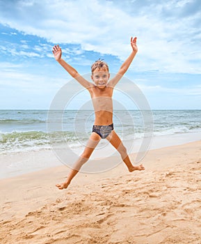 Jumping boy on the beach