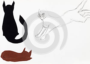 Jumping cat and two cat figures cut out of paper