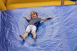 Jumping and descending on a rubber slide