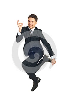 Jumping executive showing okay sign