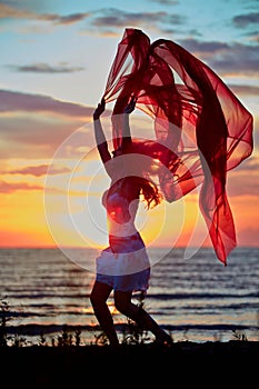 Jumping girl with red cloth