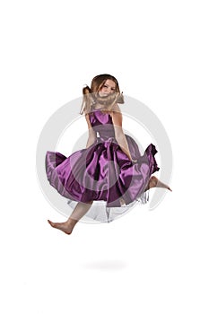 Jumping girl in violet dress