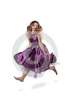 Jumping girl in violet dress