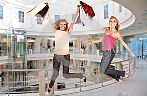 Jumping girls in shopping center, collage
