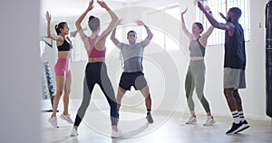 Jumping jack, cardio or people in gym for fitness workout, exercise or healthy wellness in aerobics class. Diversity