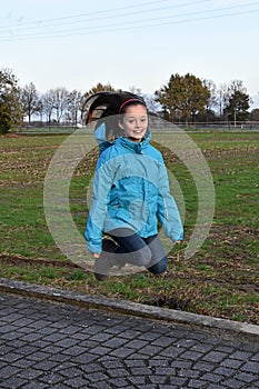 Jumping for joy, happy teenage girl