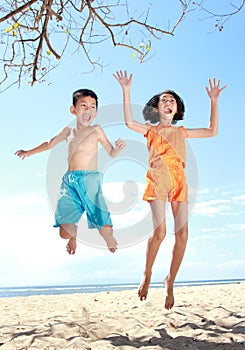 Jumping kids in the beach