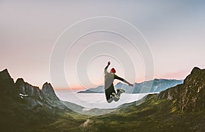 Jumping man in mountains vacations outdoor