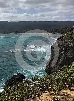 Jumping off the cliff at Laie Point