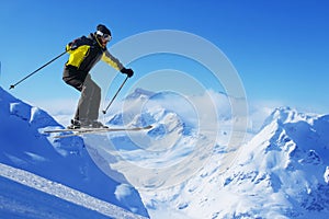 Jumping skier at mountains