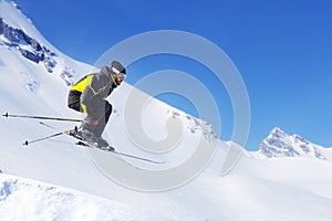 Jumping skier at mountains