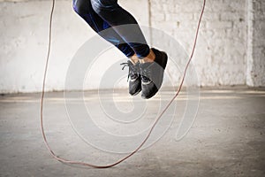 Jumping skipping rope at gym