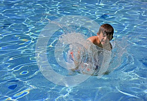 Jumping, splashing in a pool