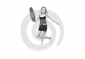 jumping teen girl skateboarding. teen girl skateboarding isolated on white. teen girl skateboarding in studio. teen girl photo
