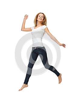 Jumping teenage girl in blank white t-shirt