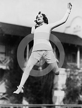 Jumping woman in midair photo