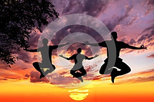 Jumping Yoga silhouettes in lotus