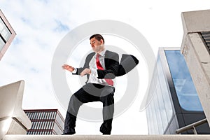 Jumping young business man