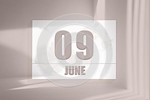 june 09. 09th day of the month, calendar date.White sheet of paper with numbers on minimalistic pink background with