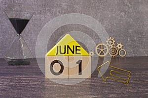 June 1st. Day 1 of month, calendar on yellow background. First summer day.