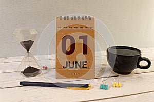 June 1st. Day 1 of month, calendar on yellow background. First summer day.