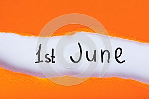 June 1st. Image of june 1 calendar on torn orange envelope background. First summer day. Happy Childrens Day