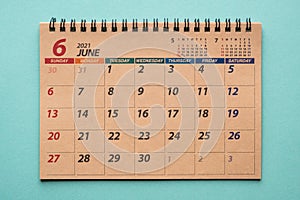 June 2021 desk calendar on green background