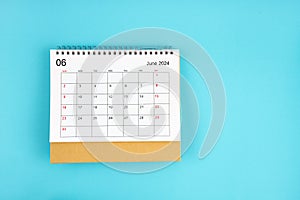 June 2024, Monthly desk calendar for 2024 year on blue background