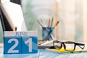 June 21st. Day 21 of month, wooden color calendar on office background. Summer time. Empty space for text