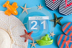 June 21st. Image of june 21 calendar on blue background with summer beach, traveler outfit and accessories. Summer day