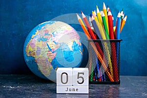 June 5 on the wooden calendar.The fifth day of the summer month, a calendar for the workplace. Summer