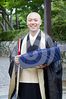 June 2012 - Arashiyama, Japan: A monk at the Tenryuji Temple temple looking at the camera and smile